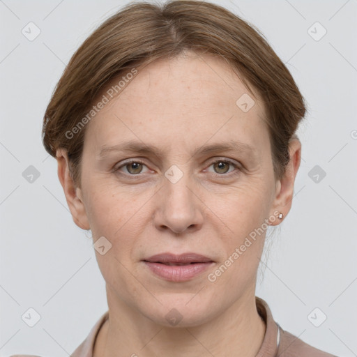 Joyful white adult female with short  brown hair and grey eyes