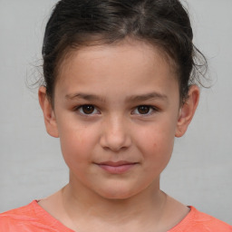 Joyful white child female with short  brown hair and brown eyes