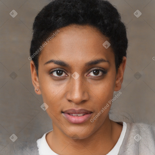 Joyful black young-adult female with short  black hair and brown eyes