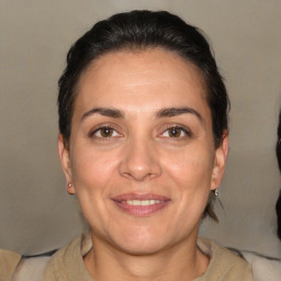 Joyful white adult female with short  brown hair and brown eyes