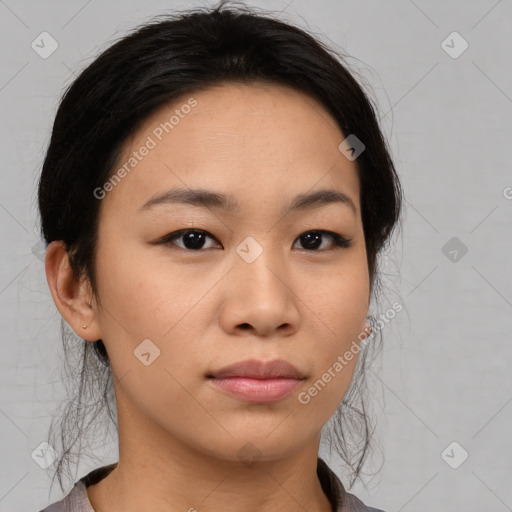 Joyful asian young-adult female with medium  black hair and brown eyes