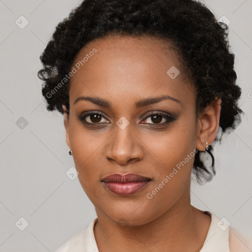 Joyful black young-adult female with medium  black hair and brown eyes