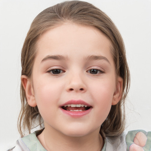 Joyful white child female with medium  brown hair and grey eyes