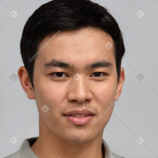 Joyful asian young-adult male with short  brown hair and brown eyes