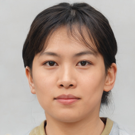 Neutral asian young-adult female with medium  brown hair and brown eyes