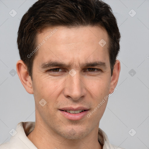 Joyful white adult male with short  brown hair and brown eyes