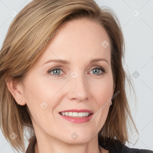 Joyful white young-adult female with medium  brown hair and blue eyes