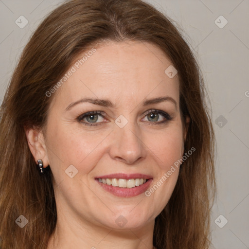 Joyful white adult female with medium  brown hair and brown eyes