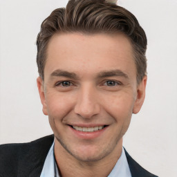 Joyful white young-adult male with short  brown hair and brown eyes