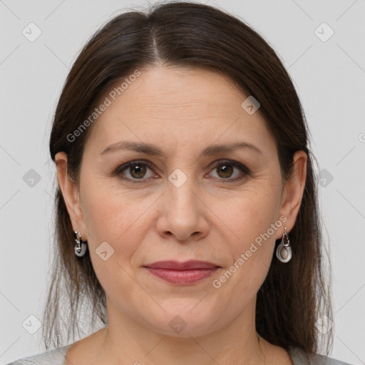 Joyful white adult female with medium  brown hair and grey eyes