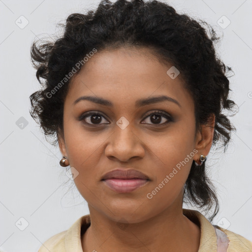 Joyful black young-adult female with long  brown hair and brown eyes