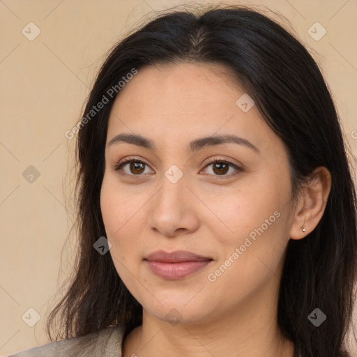 Joyful latino young-adult female with long  brown hair and brown eyes