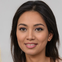 Joyful asian young-adult female with long  brown hair and brown eyes