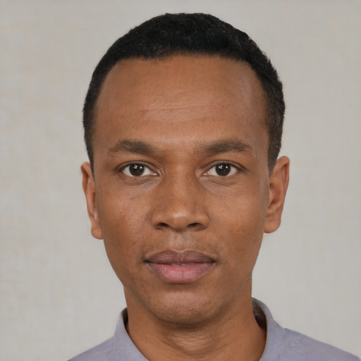 Neutral black young-adult male with short  black hair and brown eyes
