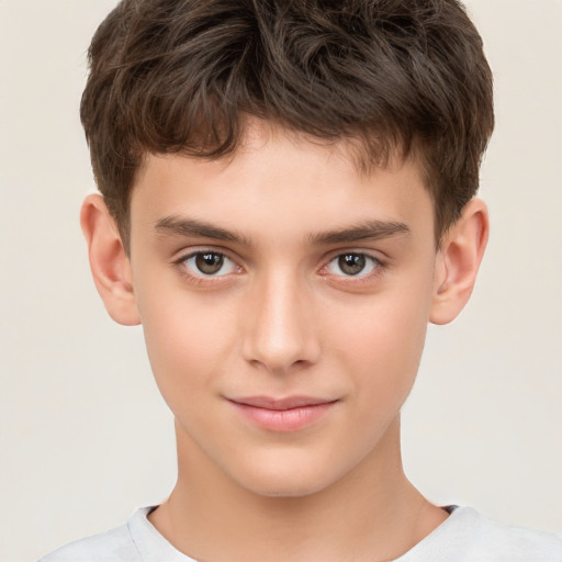 Joyful white child male with short  brown hair and brown eyes