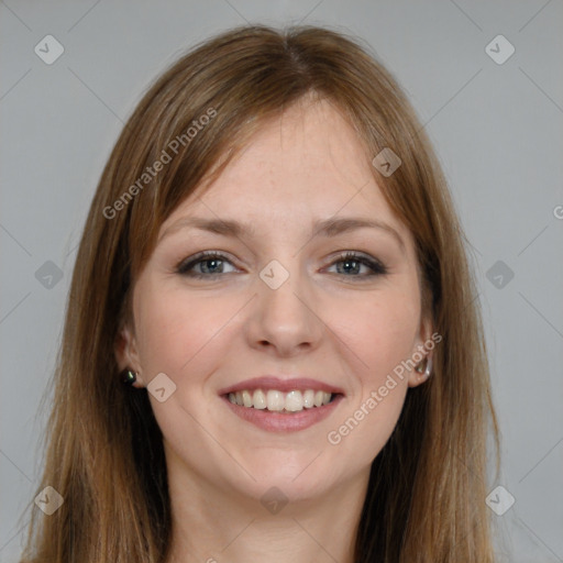 Joyful white young-adult female with long  brown hair and grey eyes