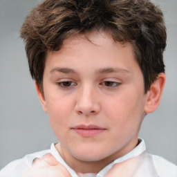 Joyful white child male with short  brown hair and brown eyes