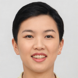 Joyful asian young-adult female with short  black hair and brown eyes