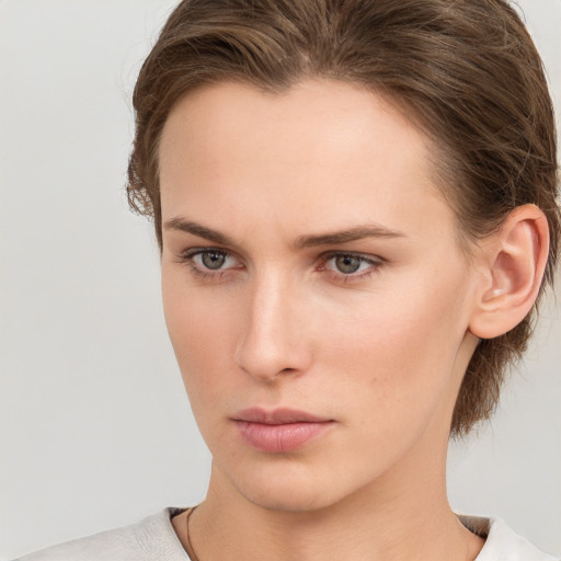 Neutral white young-adult female with medium  brown hair and grey eyes