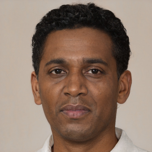 Neutral black adult male with short  black hair and brown eyes