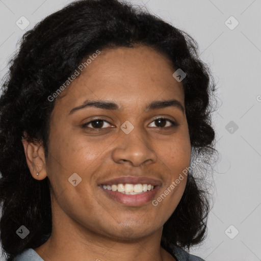 Joyful black young-adult female with long  black hair and brown eyes