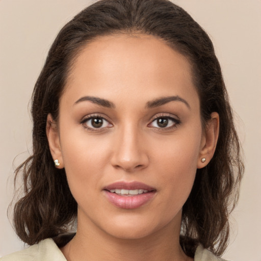 Joyful white young-adult female with medium  brown hair and brown eyes