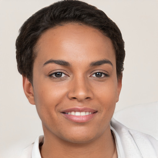 Joyful white young-adult female with short  brown hair and brown eyes