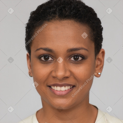 Joyful black young-adult female with short  brown hair and brown eyes