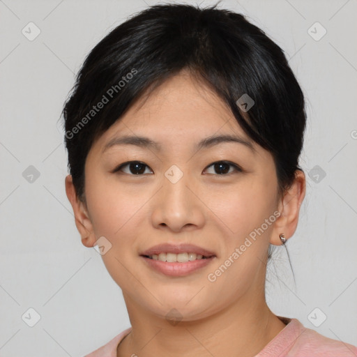 Joyful asian young-adult female with short  black hair and brown eyes