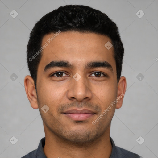 Joyful latino young-adult male with short  black hair and brown eyes