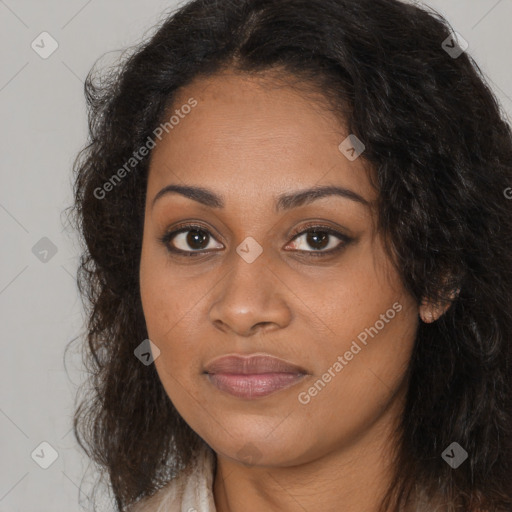 Joyful black young-adult female with long  brown hair and brown eyes