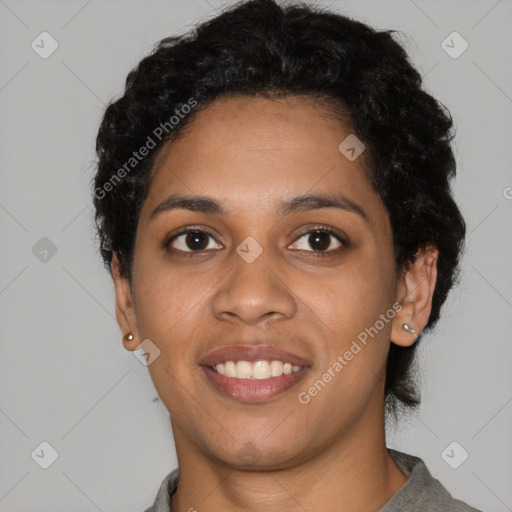 Joyful latino young-adult female with short  black hair and brown eyes