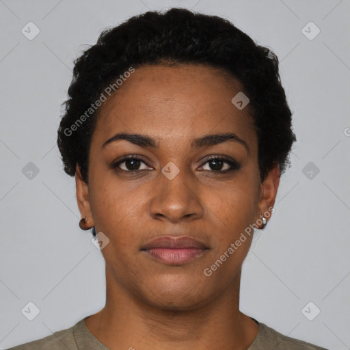 Joyful black young-adult female with short  black hair and brown eyes