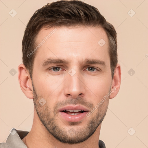 Joyful white young-adult male with short  brown hair and brown eyes