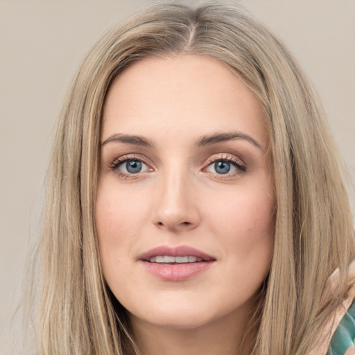 Joyful white young-adult female with long  brown hair and green eyes