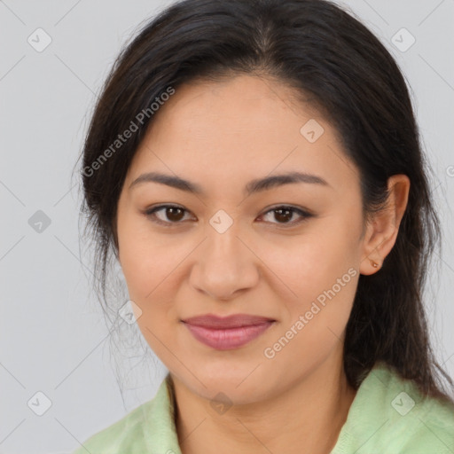 Joyful latino young-adult female with long  brown hair and brown eyes