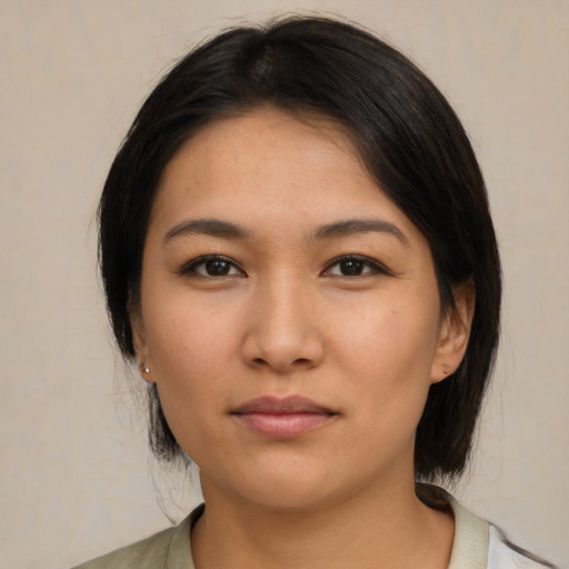 Neutral asian young-adult female with medium  brown hair and brown eyes