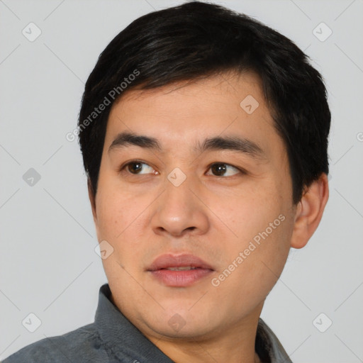 Joyful asian young-adult male with short  black hair and brown eyes