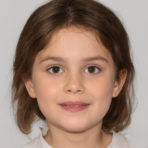 Joyful white child female with medium  brown hair and brown eyes