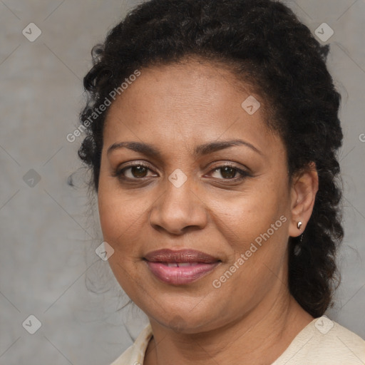 Joyful black adult female with medium  brown hair and brown eyes