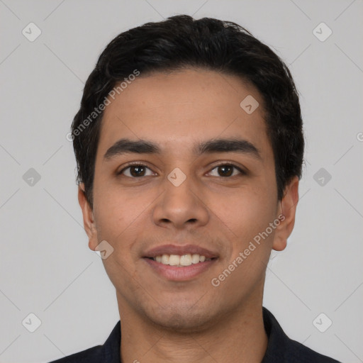 Joyful latino young-adult male with short  black hair and brown eyes