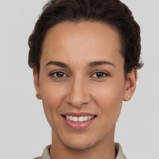 Joyful white young-adult female with short  brown hair and brown eyes