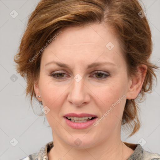 Joyful white adult female with medium  brown hair and blue eyes