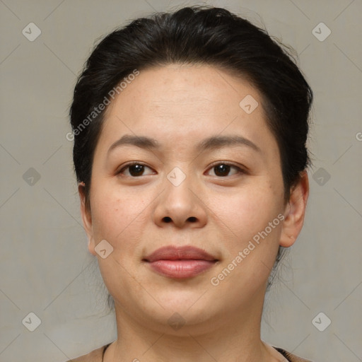 Joyful asian young-adult female with short  brown hair and brown eyes