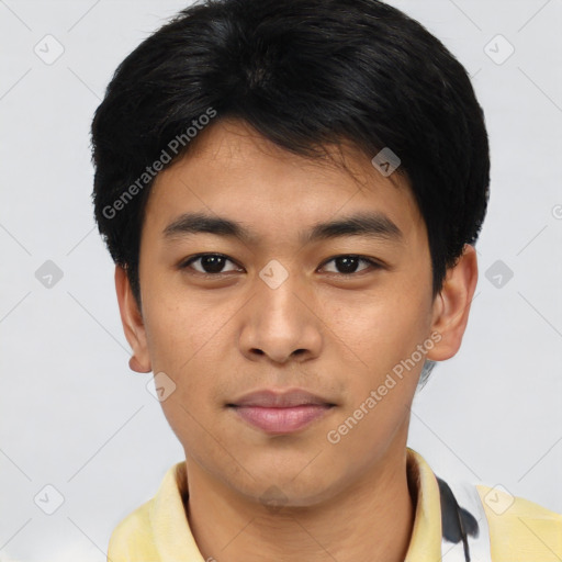 Joyful asian young-adult male with short  brown hair and brown eyes