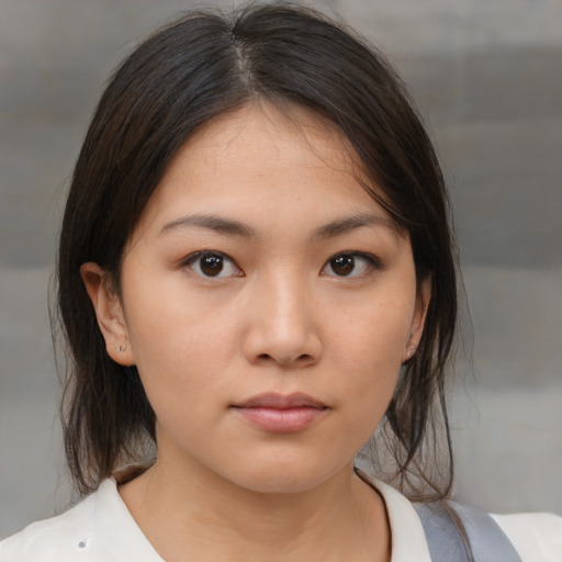 Neutral asian young-adult female with medium  brown hair and brown eyes