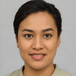 Joyful asian young-adult female with short  brown hair and brown eyes