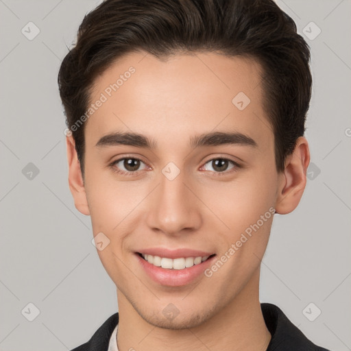 Joyful white young-adult male with short  brown hair and brown eyes