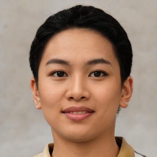 Joyful asian young-adult female with short  black hair and brown eyes