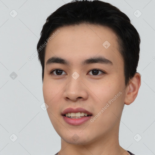 Joyful asian young-adult male with short  black hair and brown eyes